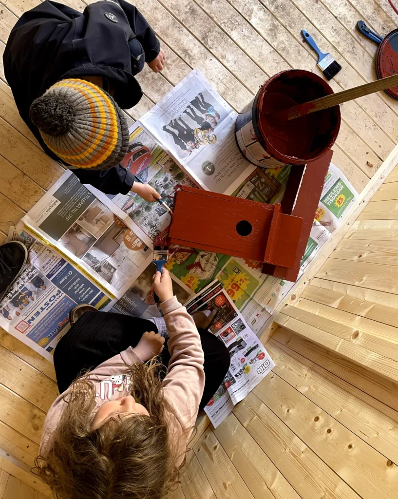 Painting the birdhouse together